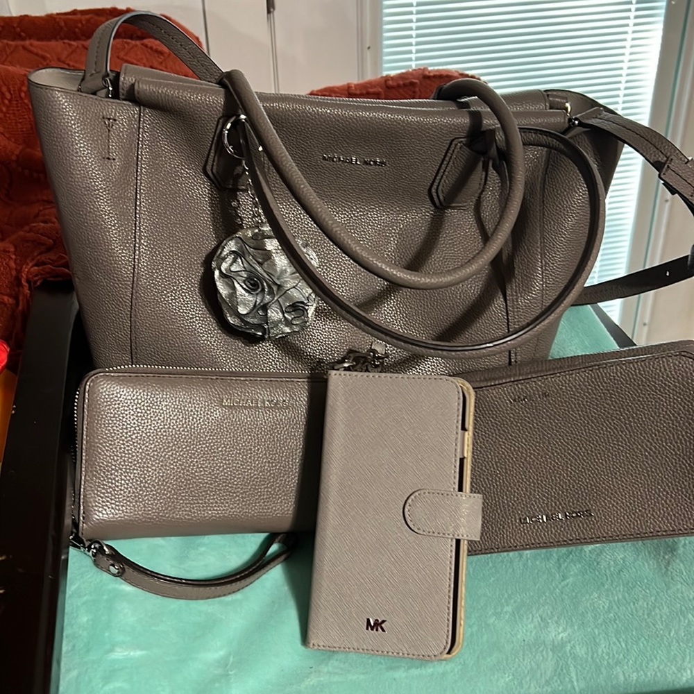 This is a large set Michael Kors Purse wallet keychain phone case make a bag